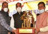 CM Thakur being presented memento at Bharadi in Bilaspur