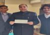 CM presented with cheque of Rs. 1.71 lakh by Shon Fulzele