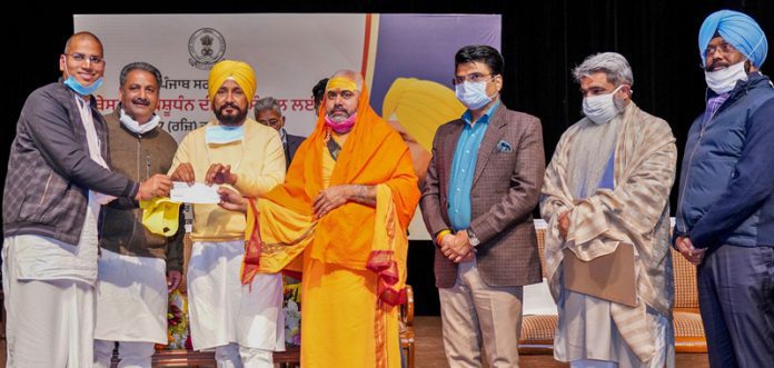 PUNJAB CM HANDS OVER CHEQUES