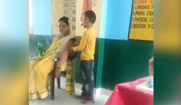 teacher gets massage from children